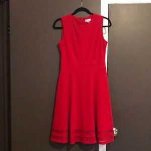 Classic red sleeveless midi dress.